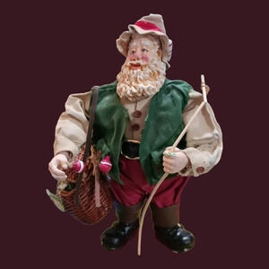 Clothique fishing santa claus figurine